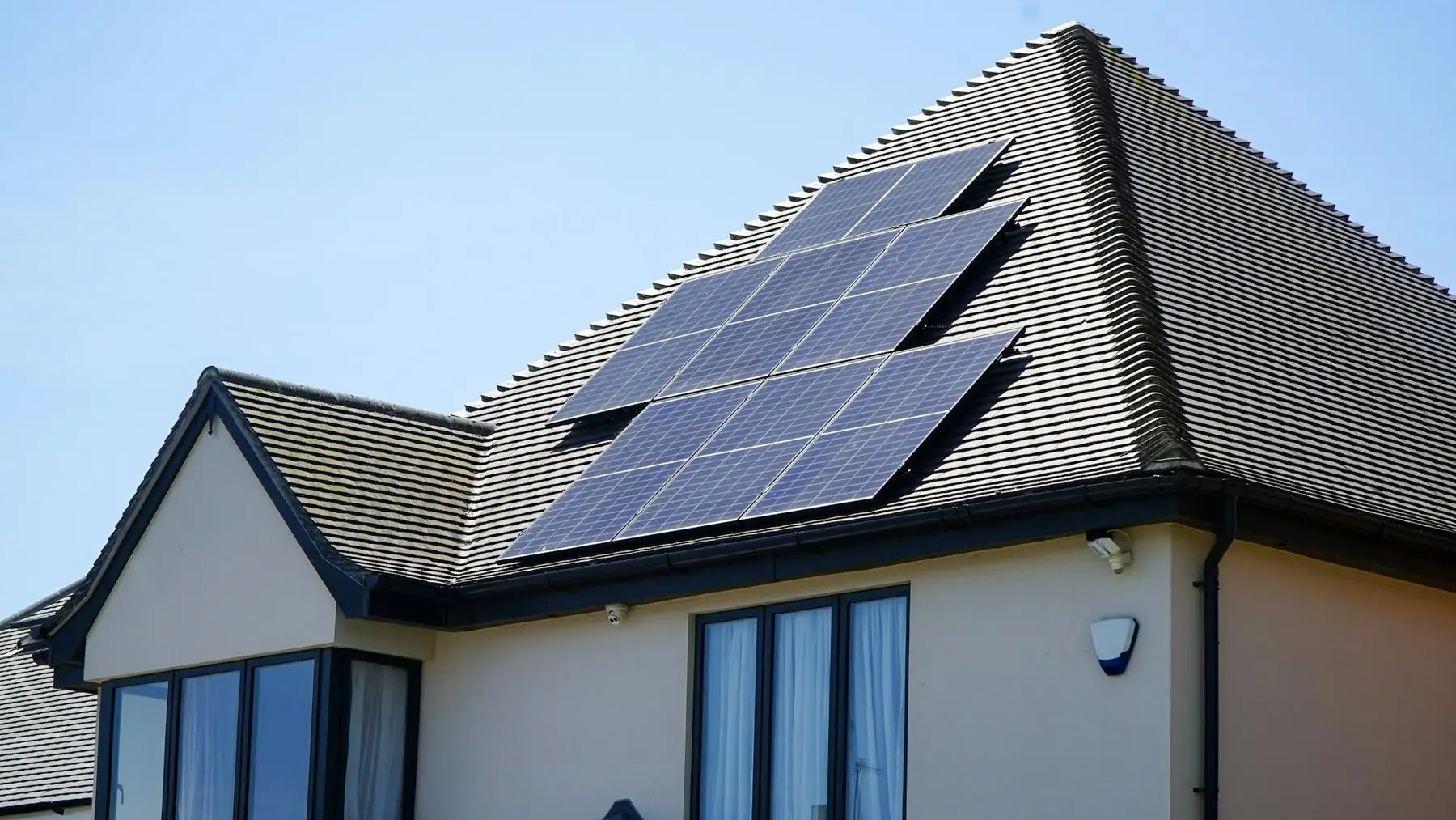 A completed rooftop solar array on a modern family home